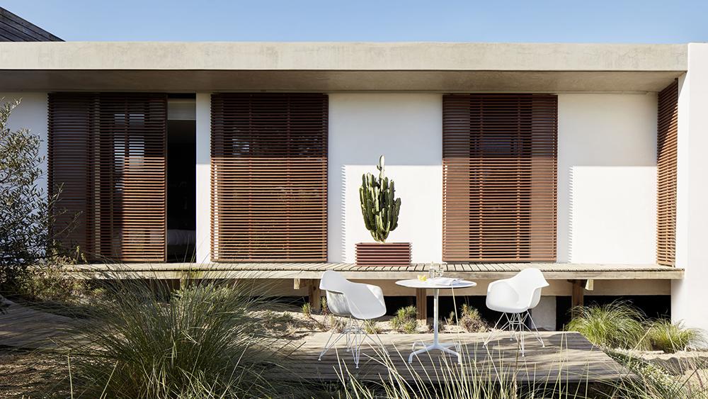 VITRA Eames Plastic Armchair with cushion and black base DAR NEW DIMENSIONS